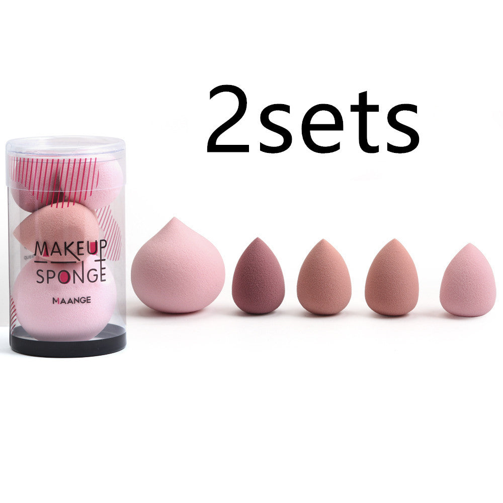 Makeup sponges with a container labeled 'MAKEUP SPONGE' and text '2 sets' on a white background.