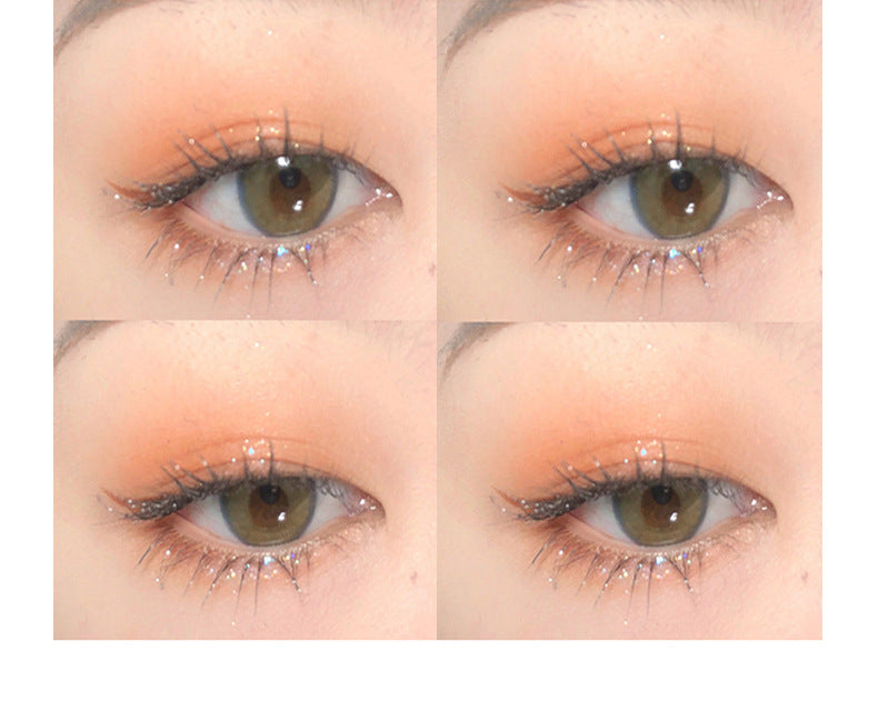 Close-up of eyes with makeup application on a white background