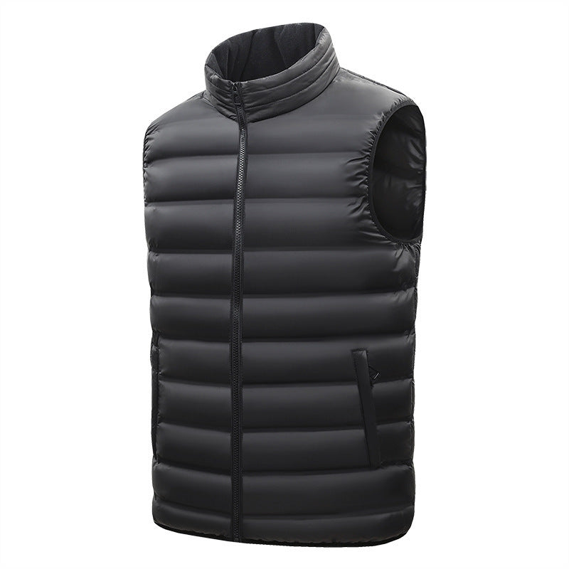 Black puffer vest on a white background