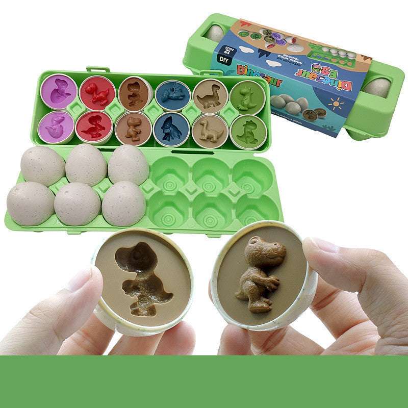 Children's mold set with dinosaur shapes and a green carrying case on a white background