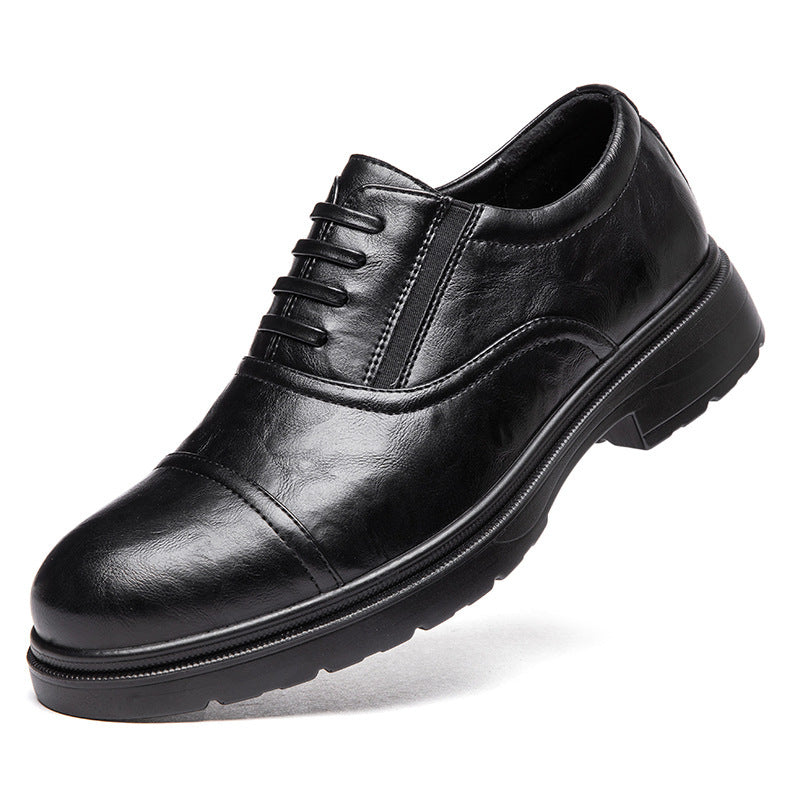 Black leather dress shoe on a white background
