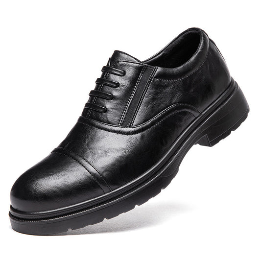 Black leather dress shoe on a white background
