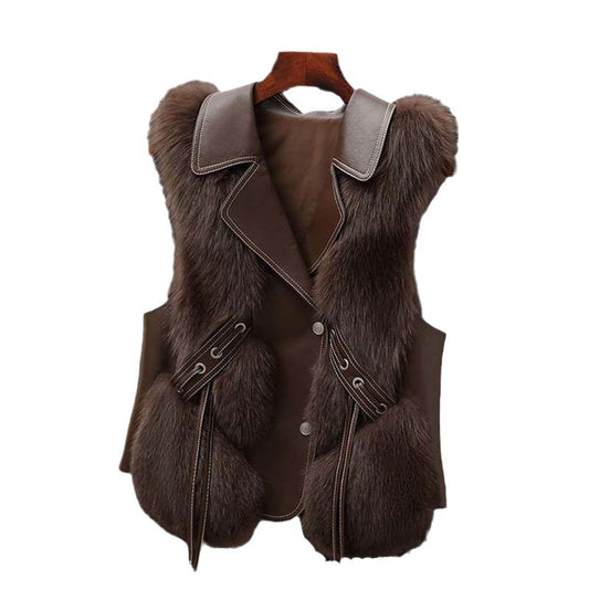 Brown fur vest with leather accents on a hanger against a white background