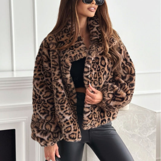Woman wearing a leopard print coat in an indoor setting