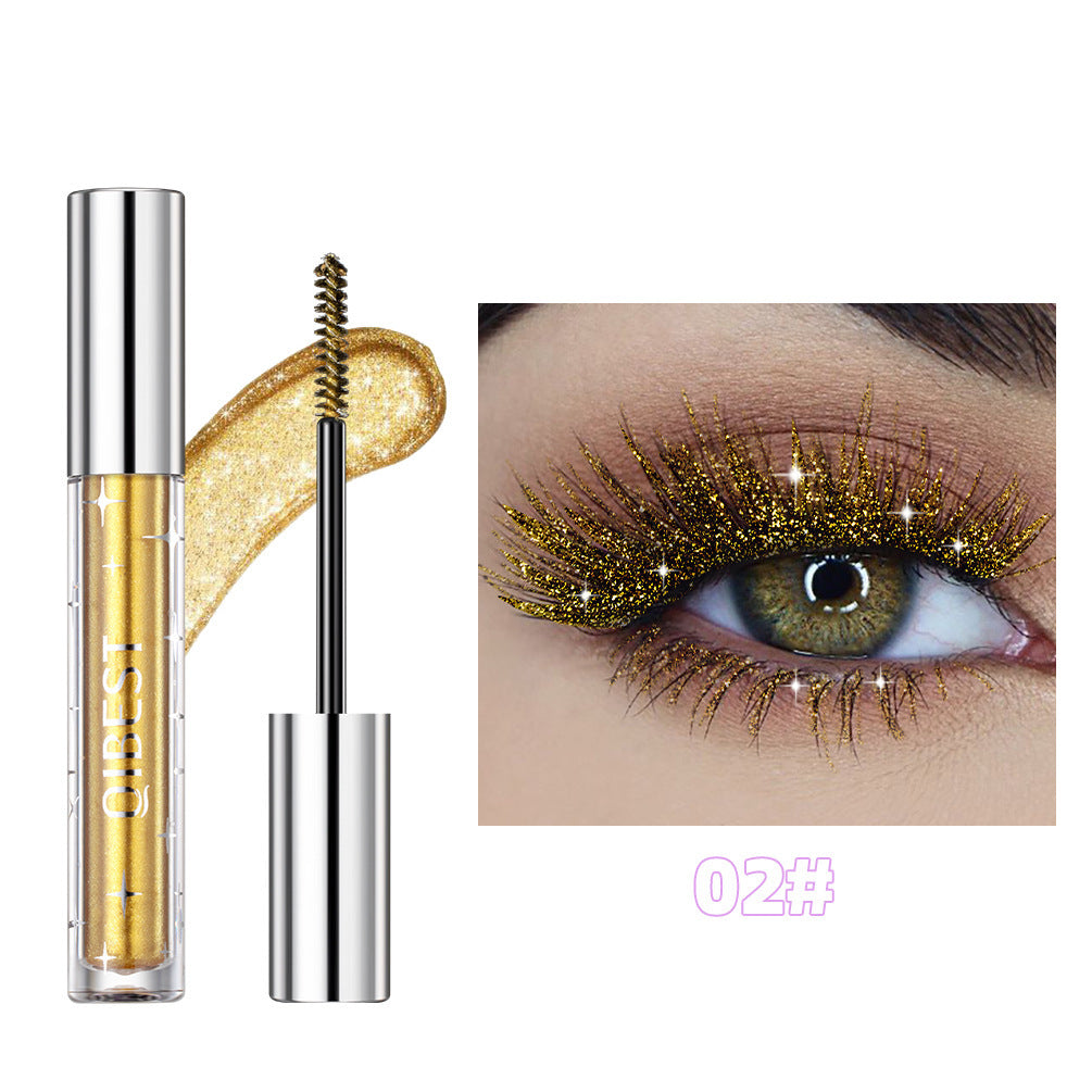 Gold-colored mascara with a close-up of an eye wearing it on a white background