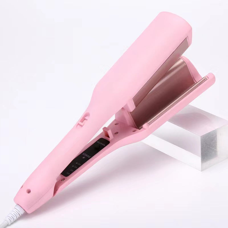 Pink hair straightener on a white background
