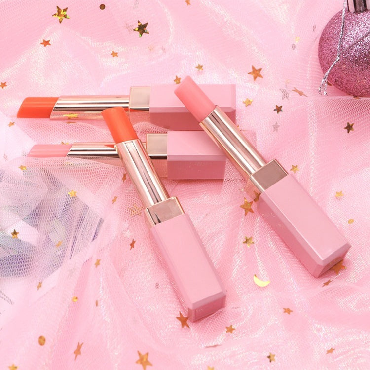 Pink lipsticks on a pink background with decorative elements