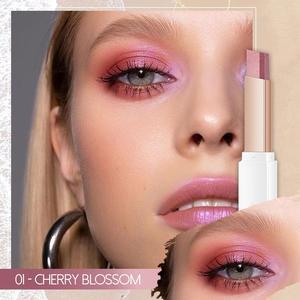 Makeup product with close-up of lips and eyes, featuring a pink lipstick.