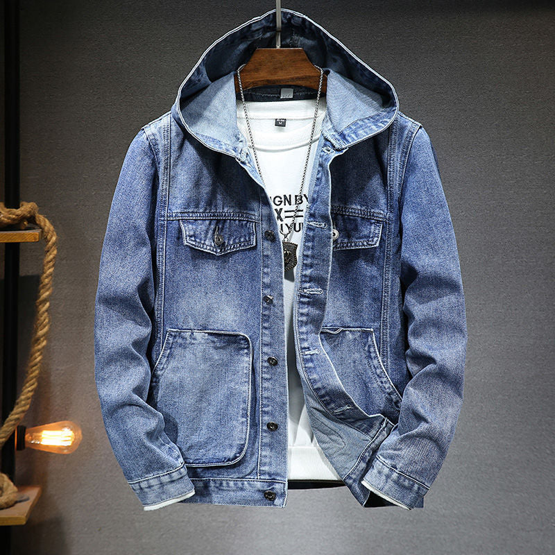 Blue denim jacket with a hood on a gray background