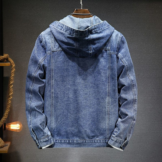 Blue denim jacket with hood on a gray background