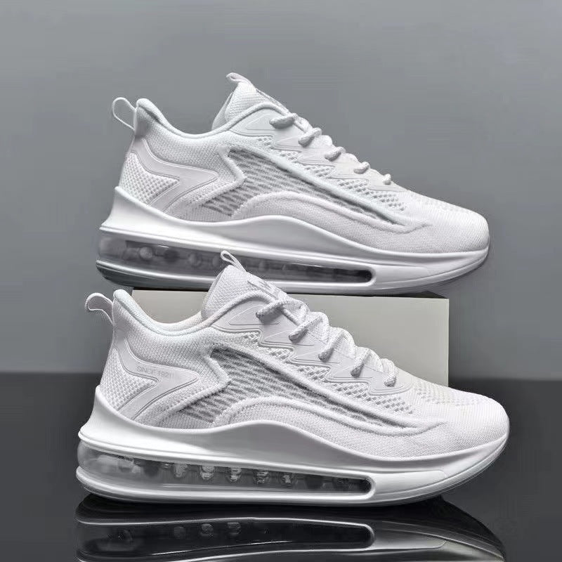 White sneakers with air cushioning on a reflective surface and gray background