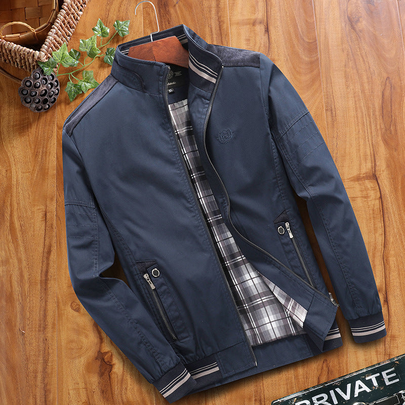 Navy blue jacket with plaid lining on a wooden surface