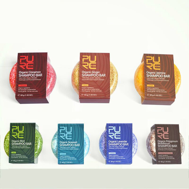Assorted Pure Organic Shampoo Bars with colorful packaging on a white background