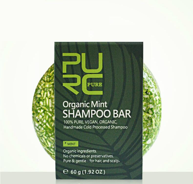 Organic mint shampoo bar with packaging on a white background