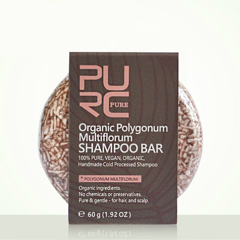 Shampoo bar with packaging labeled 'PURE Organic Polygonum Multiflorum Shampoo Bar' on a white background.