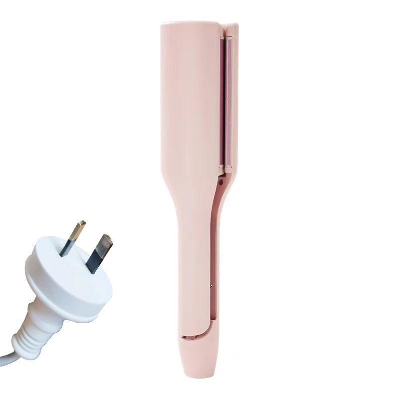 Pink hair straightener with a white plug on a white background