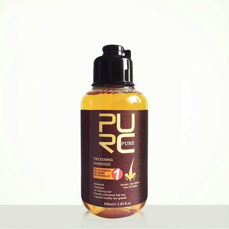 Bottle of PURC hair care product on a white background