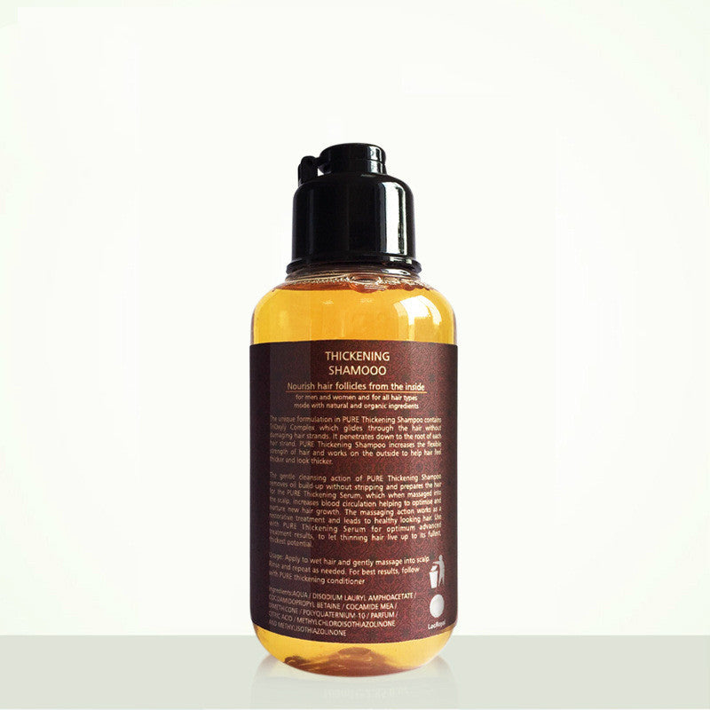 Bottle of thickening shampoo with label on a white background