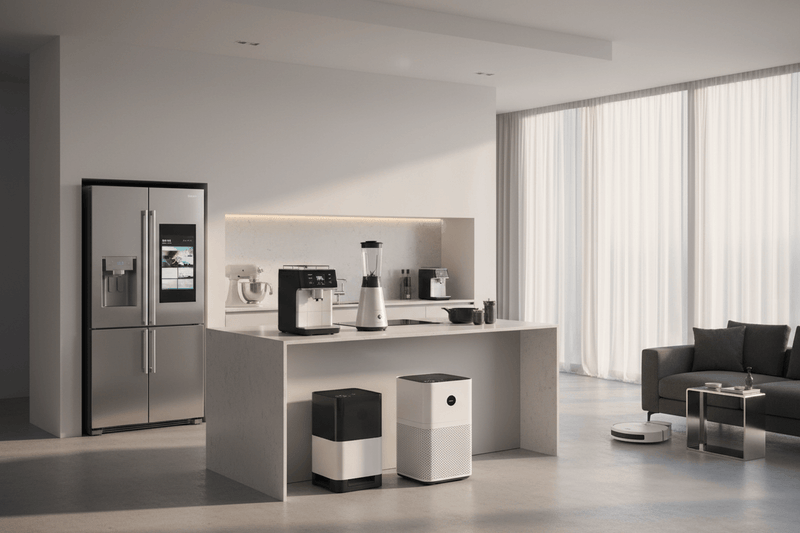 A display of stainless steel kitchen equipment and smart laundry units from the High-Performance Home Appliances collection
