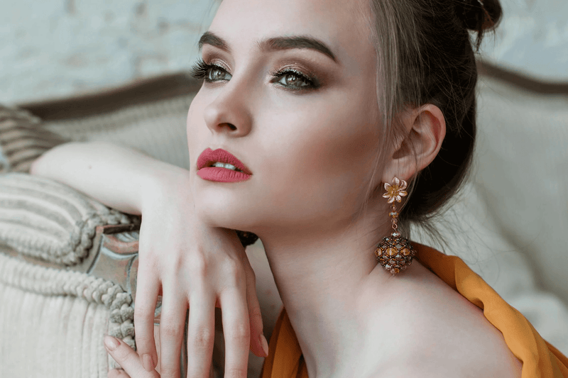 A display of layered necklaces, colorful rings, and hoop earrings from the Affordable Fashion Jewelry collection