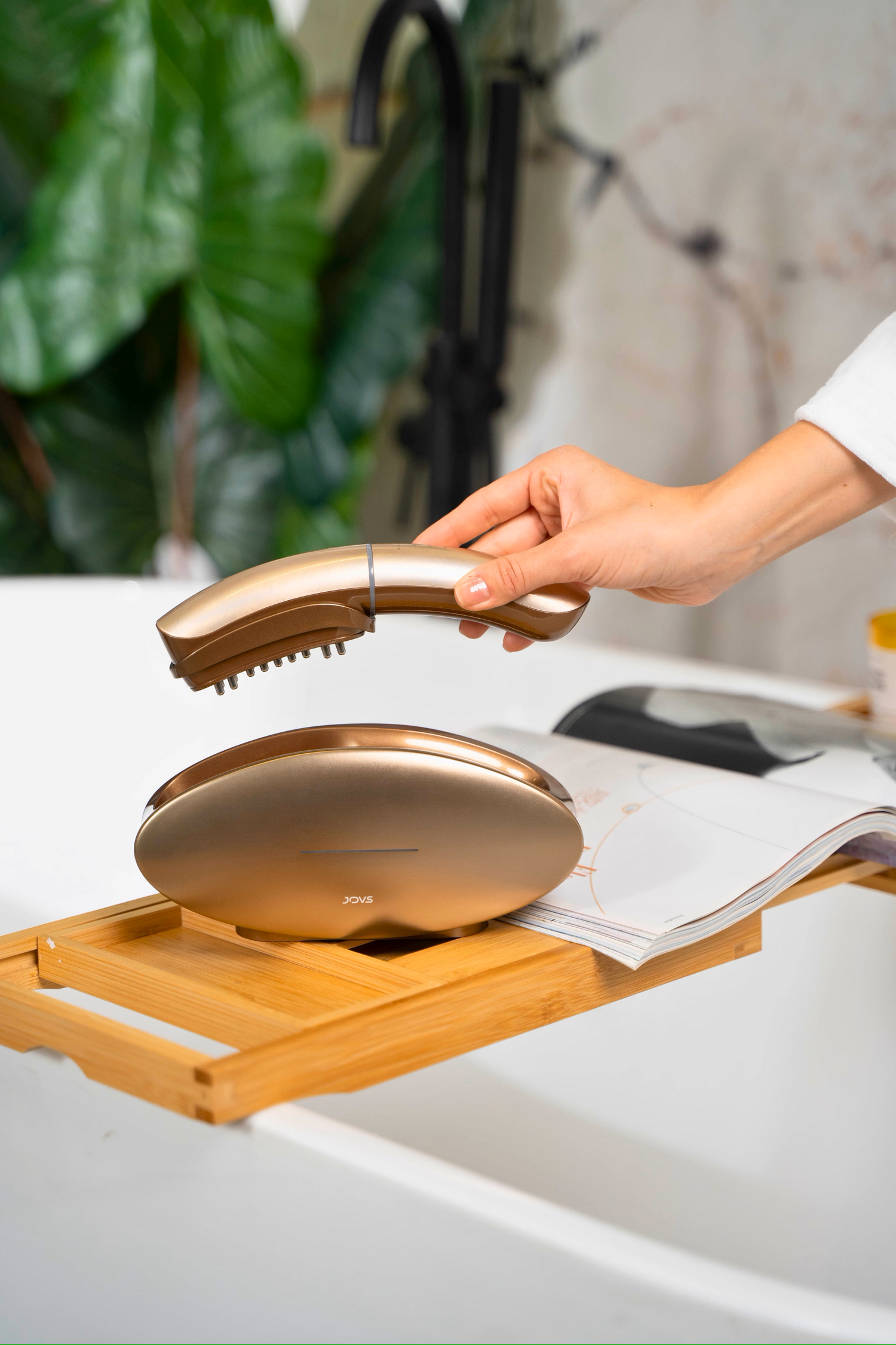 Beauty Tools showcased with a sleek golden hand-held device and bamboo tray, enhancing self-care routines.
