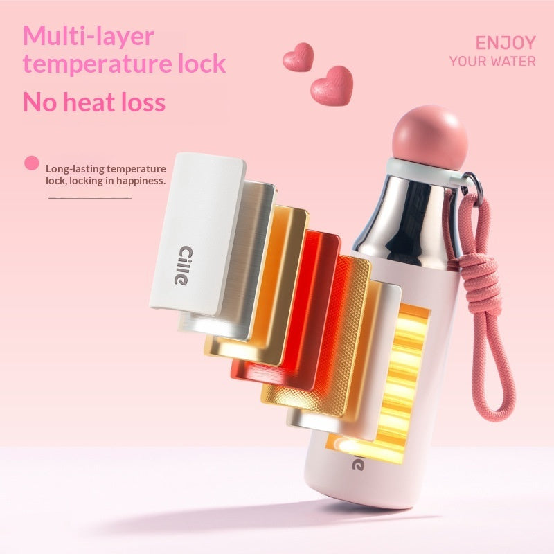 Insulated thermos mug in pink with carry cord and straw, showing multi-layer insulation.