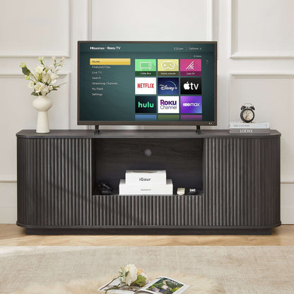 Black rounded TV stand with vertical ribbed sides, centered open shelf, and flat top
