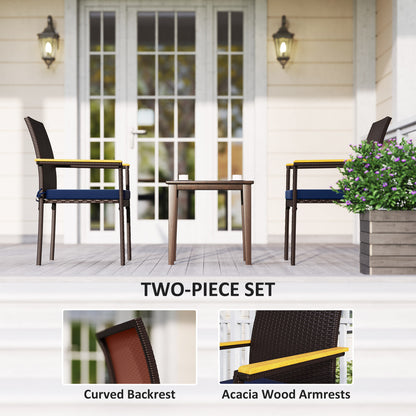 Wicker patio dining chair with dark curved backrest and blue seat cushion