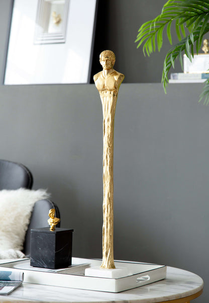 Gold Roman statue decor with raised figure and white marble base, on table