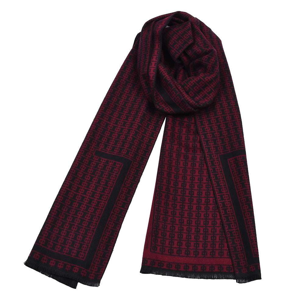 Double-sided knitted scarf in burgundy red with repeating grid pattern and dark edge