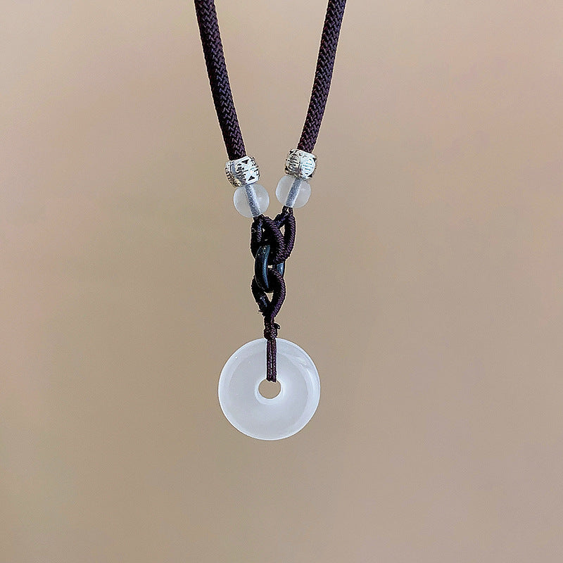 Butterfly pearl necklace with dark cord and round pearl pendant