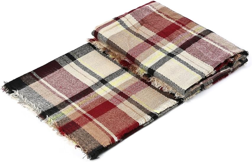 Multicolor plaid scarf with fringed edges, folded for display.