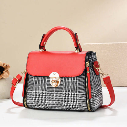 Red envelope shoulder tote with gray houndstooth front panel, gold clasp, and straps