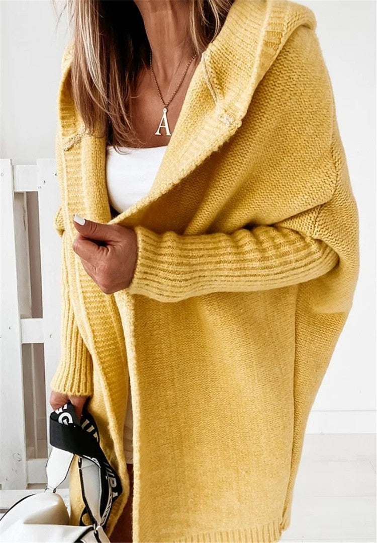 Yellow oversized hooded cardigan sweater with batwing sleeves and ribbed knit texture