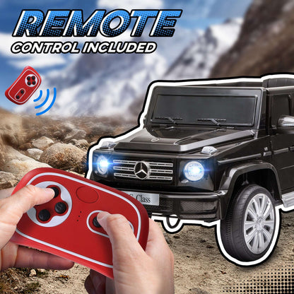 Black kids electric G-Wagon ride-on with remote control in hand and front headlights on