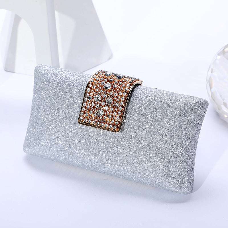 Silver glitter clutch wallet with rhinestone-framed clasp