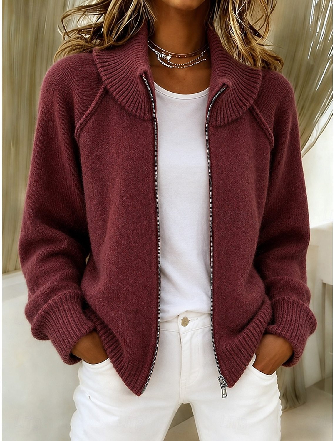Maroon knitted cardigan with stand collar and front zipper, ribbed cuffs and long sleeves