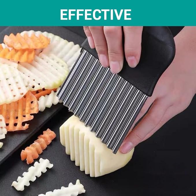 Black crinkle cutter slicer tool pressed over potato, forming ridged fries