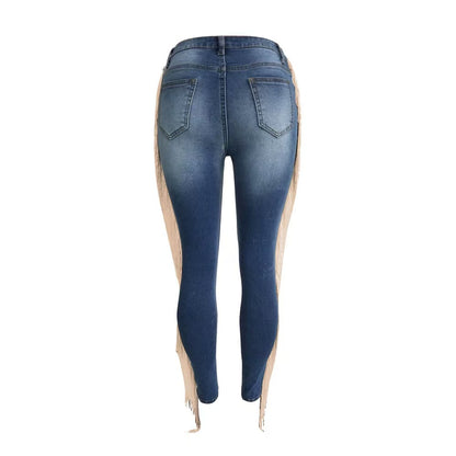Blue back view skinny jeans with distressed panels and tassel fringe