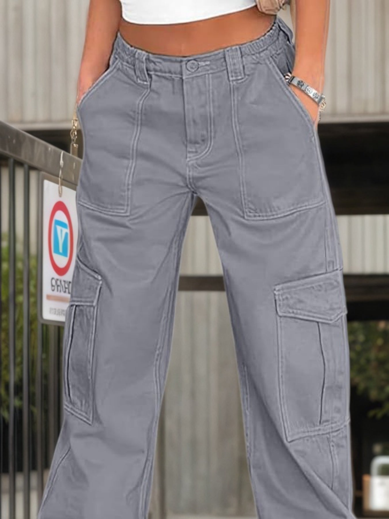 Grey cargo work pants, high-rise waist, front pleats, large side pockets, relaxed leg
