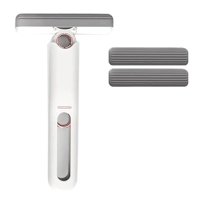 Portable mini mop with white handle and two gray replacement pad covers