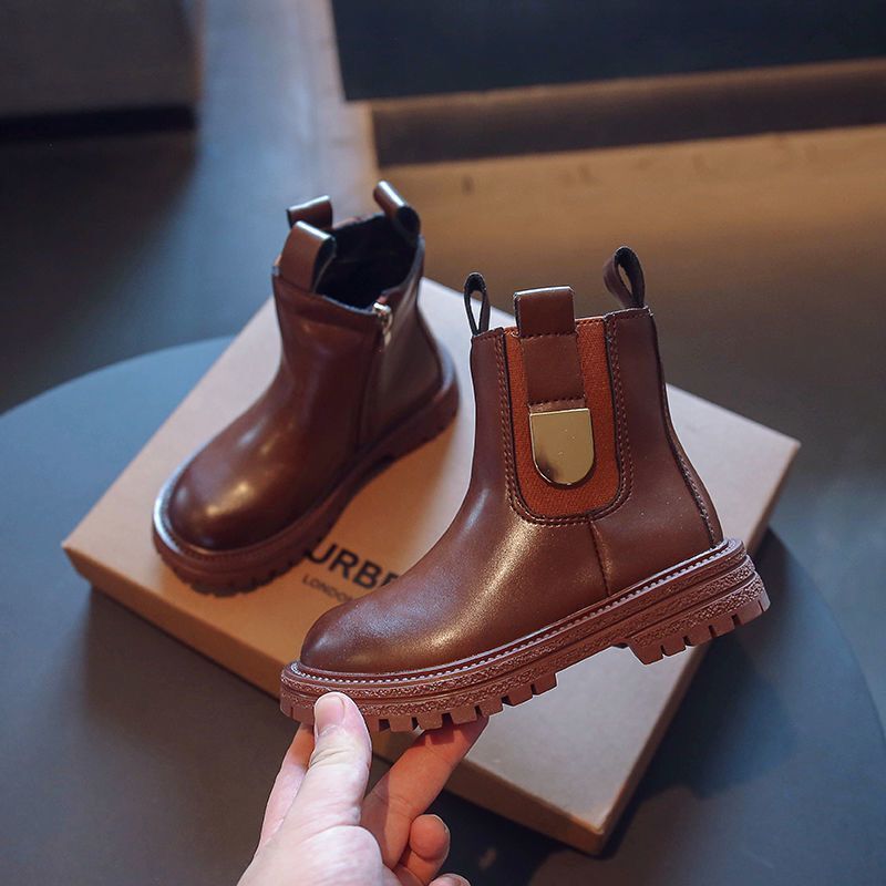 Kids Chelsea boots in warm brown with elastic side panels, pull tabs, and lug sole