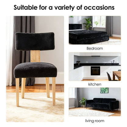 Black upholstered dining chair with tall back and light wood legs