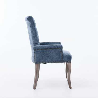 Blue tufted accent dining chair, side view, upholstered seat and curved rolled armrests