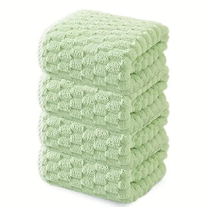 Waffle bath towel set, folded stack of light green towels with waffle texture