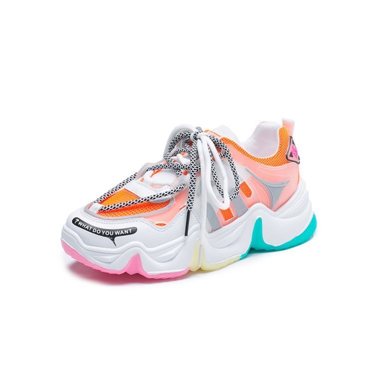 Platform sneaker with white upper, orange and pink accents, teal outsole, lace-up style