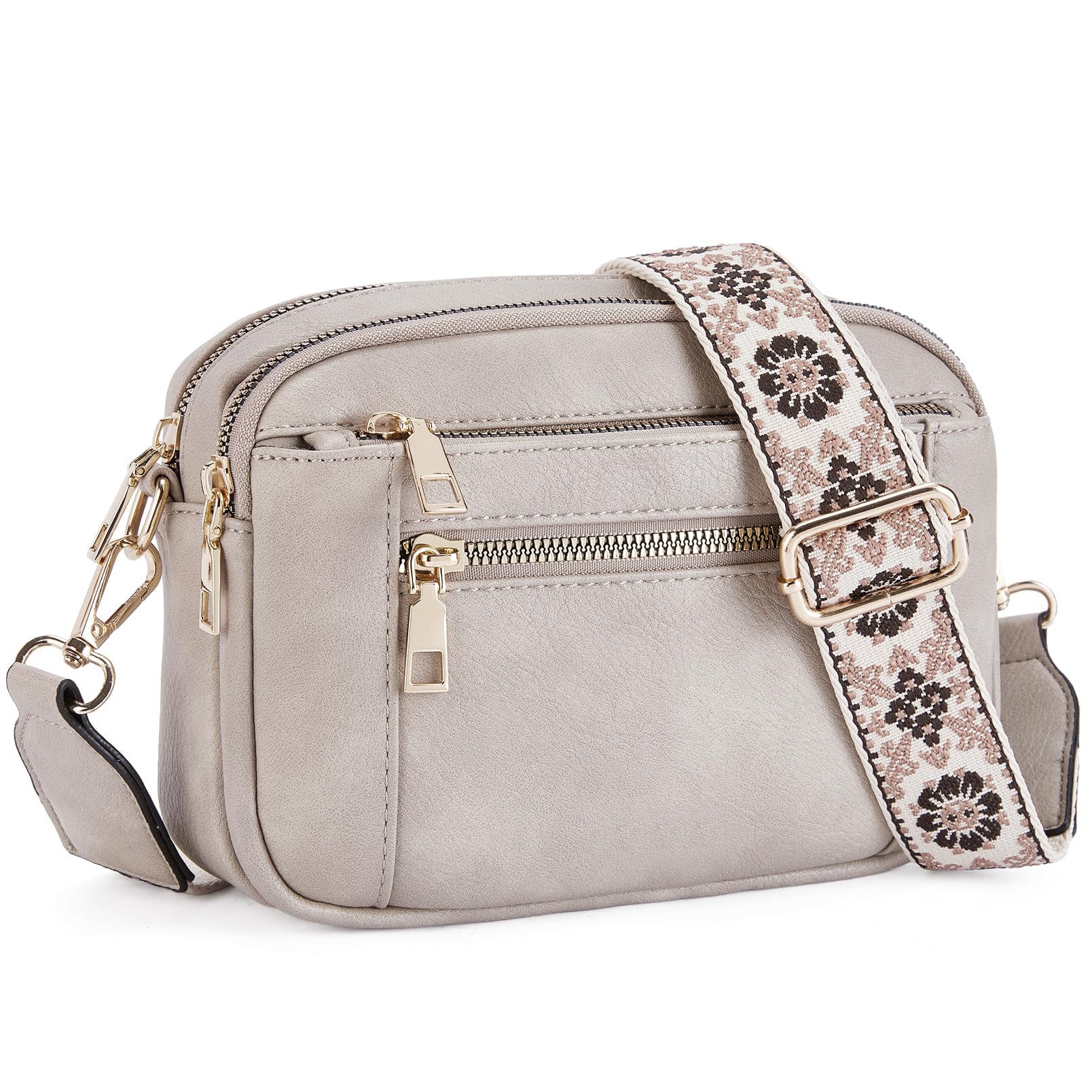 Gray triple-zip crossbody bag with floral patterned strap and gold-tone hardware