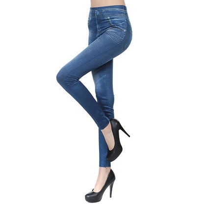 Blue high-waisted jeggings with curved seam stitching, worn with black heels