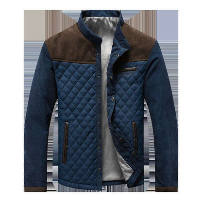 Blue quilted jacket with brown accents on a white background