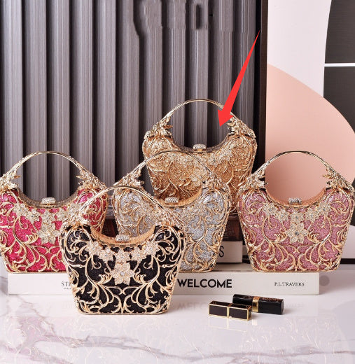Women’s hollow out shiny clutch with ornate filigree and rhinestone flower, gold tone